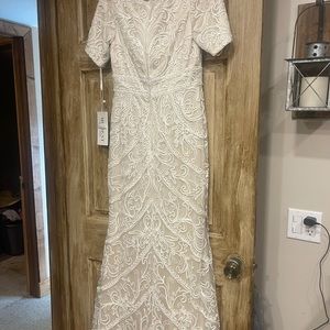 Mon Cheri wedding gown.  Brand new with tags size 12